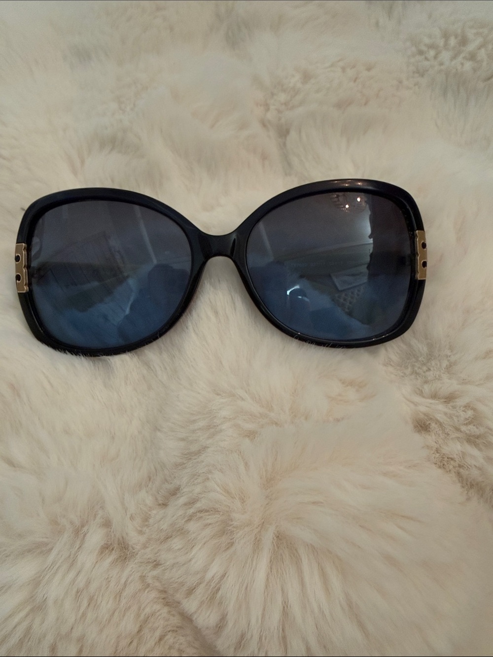 Tory Burch Black Frame Sunglasses with Blue Lenses and Gold Accents cream arms
